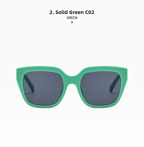 Detail view of large matte mint green square frame sunglasses with dark grey UV lenses