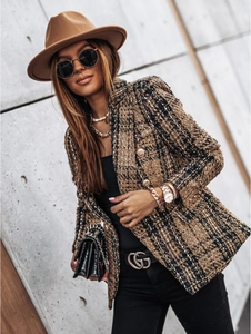 Close-up of double-breasted tweed jacket with plaid pattern and gold metal buttons