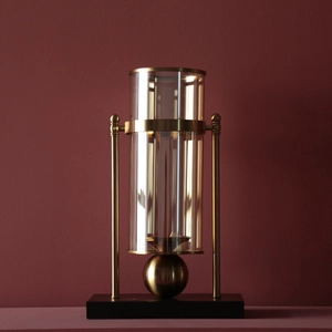 Nordic luxury gold metal and glass candle holder centerpiece with a black base