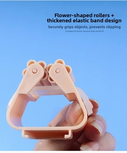 Close-up of wall-mounted mop holder with floral rollers and elastic strap in pale pink
