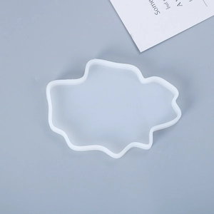 Detailed view of irregular white silicone coaster mold for DIY epoxy resin art crafts