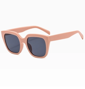 Detail view of large frame sunglasses in nude beige with dark grey square lenses