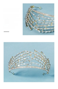 Detail of a luxury gold bridal tiara featuring layered rhinestones and intricate craftsmanship