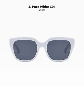 Detailed top view of solid white oversized sunglasses with dark gray lenses and wide temples