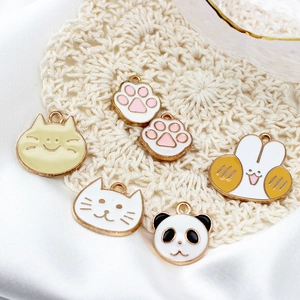 DIY gold alloy enamel charms featuring cute cat, panda, and paw patterns on silk