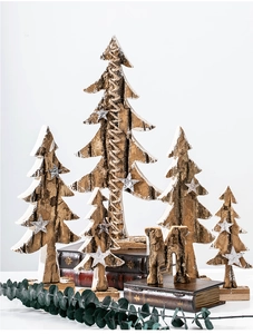Detail of natural birch bark textures on rustic wooden Christmas trees with stars