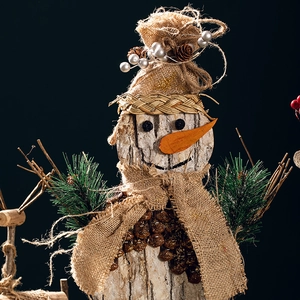 Handcrafted rustic wooden snowman decoration with natural bark, pine cones and burlap accents