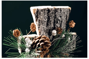 Detail of wooden Christmas ornament with pine cones, needles and silver berries
