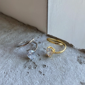 Detail of adjustable 925 sterling silver rings with teardrop cubic zirconia stones