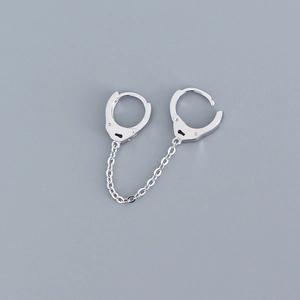 Detail of S925 sterling silver chain earrings with a unique polished handcuff link design