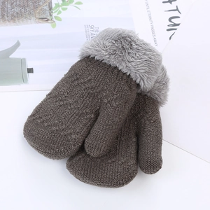 Detailed view of dark brown knit winter mittens with gray plush cuffs for toddlers