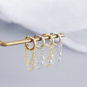 Detailed view of S925 sterling silver tassel earrings in gold and silver finishes