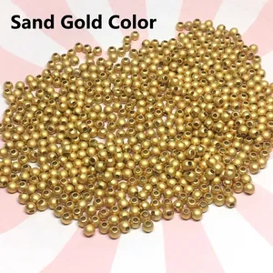 Macro shot of sand gold solid copper spacer beads with frosted texture for DIY jewelry