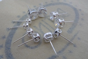Macro view of multi-size round cubic zirconia stud earrings set in 925 silver finish