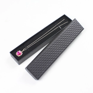 Pink gemstone pendant necklace displayed in a premium black textured jewelry gift box