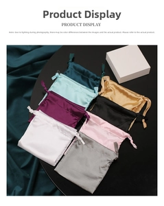 Macro shot of assorted colorful satin drawstring storage bags with premium smooth texture
