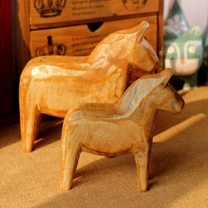 Set of two Nordic wooden Dala horse ornaments with natural grain for home decor