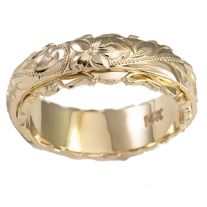 Exquisite 14K gold floral engraved ring with tropical leaf patterns on a white background