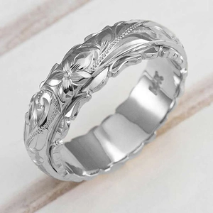 Silver wide band ring with engraved rose flower patterns and 14K hallmark on inner surface