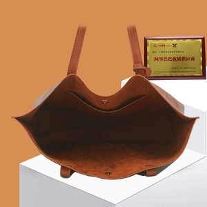 Brown vintage oil wax leather bucket tote bag with spacious interior and magnetic closure