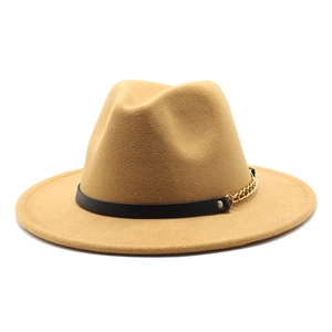 Detail of camel wool fedora hat featuring black leather band and gold metal chain accent