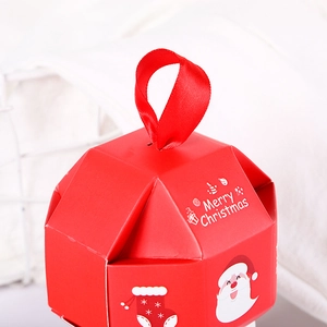 Red Christmas gift box with Merry Christmas print, ribbon handle and star patterns