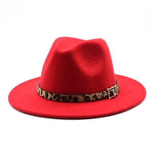 Detail view of the red wool fedora with a leopard print band and gold buckle