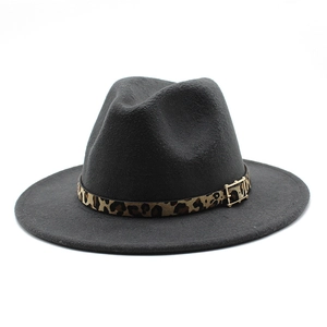 Detail of dark grey wool fedora hat featuring a leopard print band and golden buckle