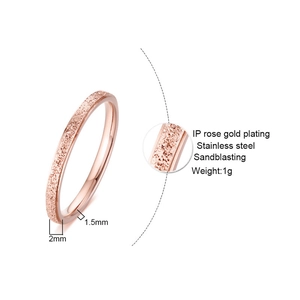 Detail view of 2mm rose gold stainless steel ring with elegant sandblasted texture