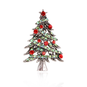 Vintage silver Christmas tree brooch with festive red and green rhinestones on white base