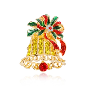 Christmas bell brooch pin with red green enamel and sparkling rhinestones on white background