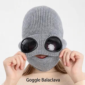 Grey knit aviator balaclava hat with integrated goggles and warm ear protection