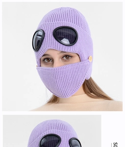 Detail of purple aviator knit hat with built-in goggles and removable face mask
