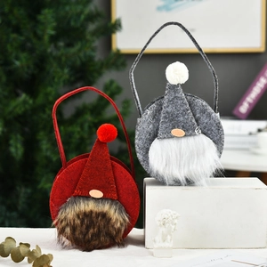 Detail of red and grey Christmas gnome gift bags with plush felt texture and soft faux fur