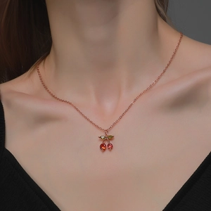 Elegant cherry pendant necklace with red crystals and rose gold chain for women