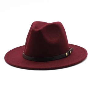 Classic burgundy wool fedora hat with wide brim and studded leather band for autumn