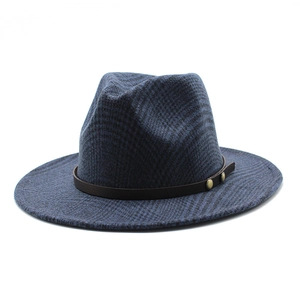 Detail of dark blue checkered fedora hat with brown leather band and gold metal buckles
