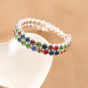 Sparkling double-row stretch bracelet with colorful rhinestones on a heart ceramic plate