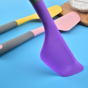 Professional purple silicone spatula for baking and mixing cakes with ergonomic gray handle