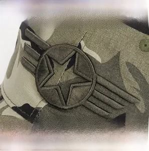 Detail of embroidered five-pointed star wing logo on camouflage cotton baseball cap