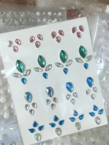 Detail of multi-color floral teardrop rhinestone stickers for eye and nail art decoration