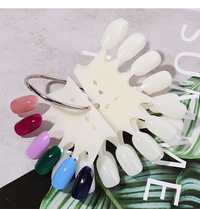 Detail of crown-shaped nail art color swatches with vibrant gel polish on a metal ring