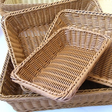 Detail view of stackable brown woven storage baskets with realistic rattan texture