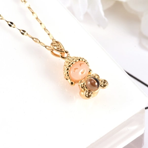 Smiling Buddha pendant in gold finish with faux jade inlay on a delicate steel chain