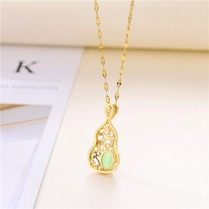 Golden hollow gourd pendant necklace with green jade stone inlay on a gold chain