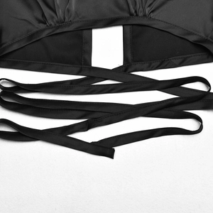 Detailed view of the back of the black satin crop top with lace-up crisscross straps