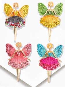 Detailed view of four ballerina brooches with colorful rhinestones and gold plating