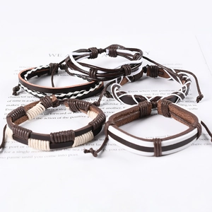 Handmade multilayer punk leather bracelet set with woven straps in neutral colors