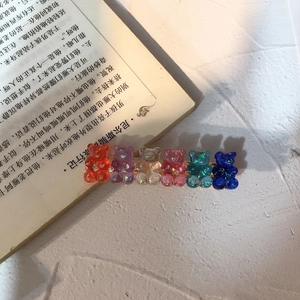 Detail of colorful resin bears on a hair clip with sparkling glitter filling inside