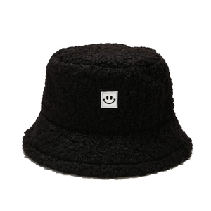 Winter black teddy fleece bucket hat with minimalist white square smiley face patch